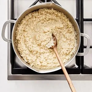 RiceSelect Arborio Rice for Italian Risotto, Premium Gluten Free Rice, Non-GMO, 32 Ounce Jar - Plain risotto cooking in a pot