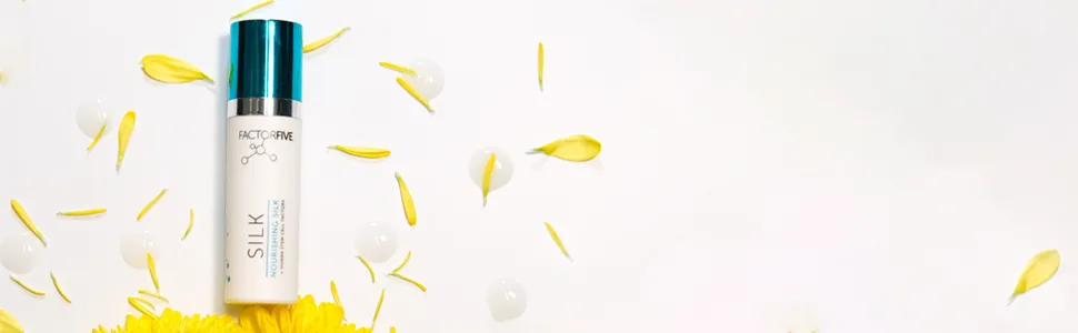 Nourishing Silk mini - mini silk on white background with yelllow flower petals