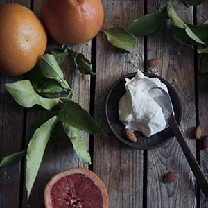 Farmstead Apothecary Grapefruit Almond Sampler- with 1 oz Face Cream Body Lotion and Body Butter - Freshly made lotion on table with grapefruit