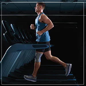 Curad CURIM23333H Performance Series Ironman Knee Support with Side Stabilizers Adjustable Universal - CURAD Performance Knee Support with Sides Support
