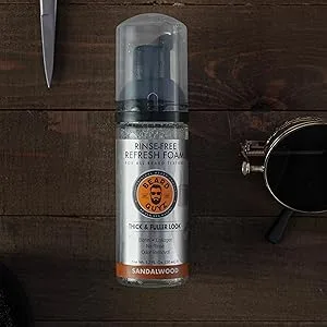 Beard Guyz Rinse-Free Refresh Foam - Rinse-free Refresh Foam bottle on a wooden background next to a pair of scissors.