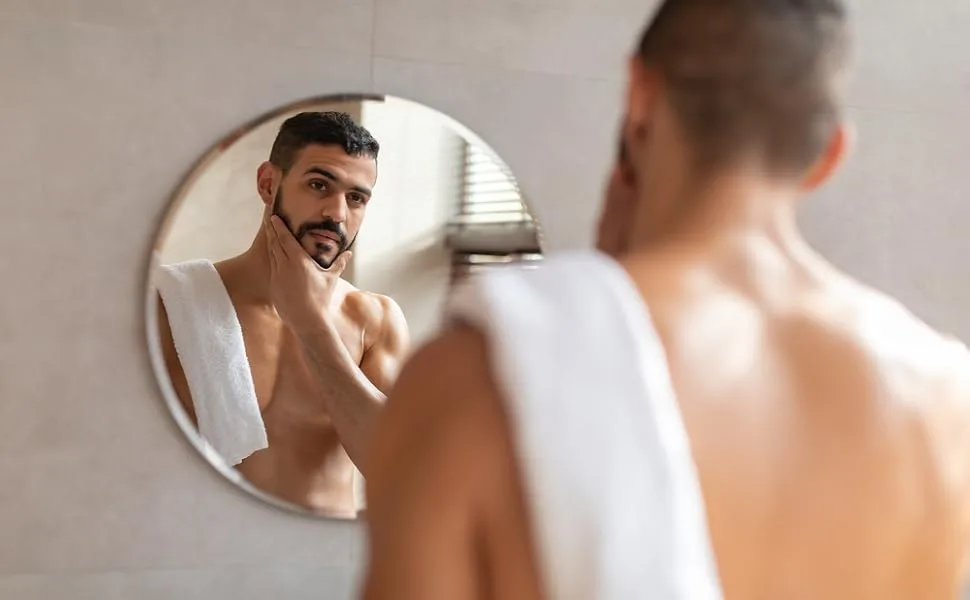 Hair Scalp & Beard Exfoliating and Deep Moisturizing Scrub - Man looking at himself in mirror