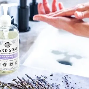 Liquid hand soap Lavender Fields 64oz refill - Person washing hands with Rustic Strength Lavender Hand Soap