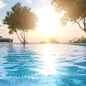 Washing Soda for Laundry 5 lb. Sodium Carbonate (Soda Ash) 99.95% Purity - low angle image of pool with sunset peeking through two trees