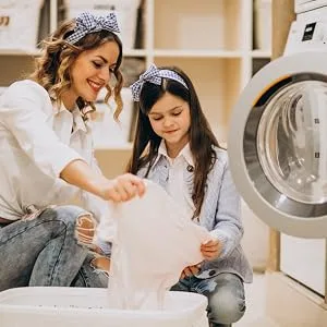 Washing Soda for Laundry 5 lb. Sodium Carbonate (Soda Ash) 99.95% Purity - Mother and daughter sorting through clean laundry in laundryroom