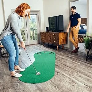 PUTT-A-BOUT Par Three Golf Putting Green - Couple in living room playing on PUTT-A-BOUT Par 3 Putting Green, golf putting mat