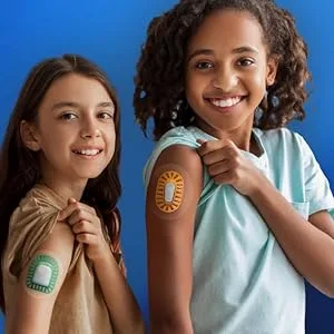Dexcom G6 Grip Shield by Deck My Diabetes- The Ultimate Bump Protection. Flexible and Reusable Armor for Dexcom Users. (Aqua) Neon Teal - two children wearing GripShields on their arm