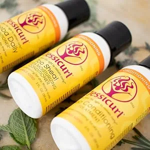 Jessicurl Clarifying Shampoo 8 Fl Oz No Fragrance Added A Routine Reset for Wavy Curly and Coily Hair - three bottles with Jessicurl labels on a board with leaves underneath