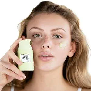 Celery Juice Serum-in-Oil Emulsion - Model holding the product bottle