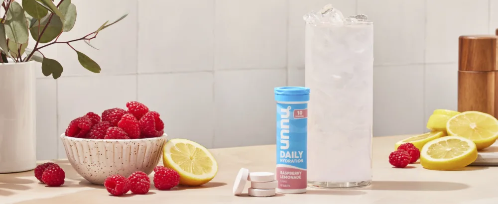 Nuun Hydration Electrolyte Tablets - Dissolvable in Water Complete Pack | 5 Essential Electrolytes for Hydration | 1g Sugar Drink Mix | Vegan Non-GMO | 4 Pack (40 Total Servings) - nuun daily on a countertop with fruits