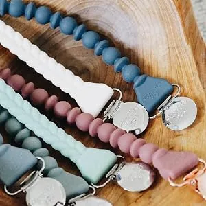 Itzy Ritzy Silicone Pacifier Clip 100% Silicone Pacifier Strap with Clip Keeps Pacifiers, Teethers & Small Toys in Place Features One-Piece Design & Silicone Cord, Pink + Rose Gold Clip - itzy ritzy, itsy ritzy, pacifier clip, beaded pacifier clip, silicone pacifier clip, pacifier leash