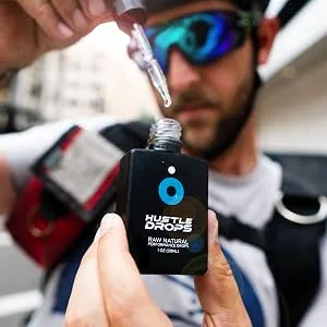 Hustle Drops - Natural Respiratory Support for Sports and Fitness - biker taking hustle drops