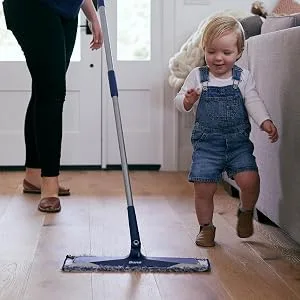 Bona Microfiber Dusting Pad, for Hardwood and Hard-Surface Floors, fits Bona Family of Mops - woman dusting floor with Bona Microfiber Mop and Bona Microfiber Dusting Pad
