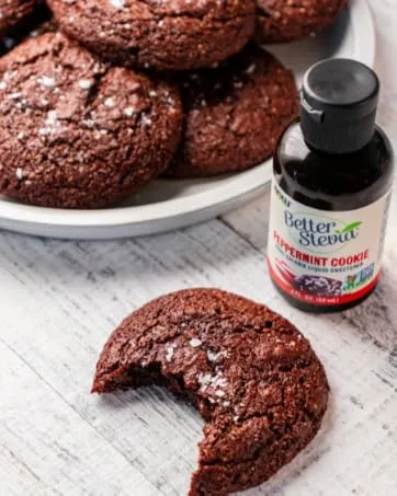 NOW Caring Tea Organic Hibiscus Tea Premium Unbleached Tea Bags with our no-staples design 24 Count - NOW Foods Better Stevia Peppermint cookie with chocolate cookies on table