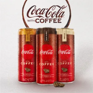 Coca-Cola with Coffee - Coffee Vanilla | 12 fl oz. Slim Cans, 69 mg of caffeine | Pack of 12 - dark blend coffee vanilla zero sugar caramel coke Coca-Cola soda seltzer sparkling juice caffeine