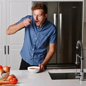 True Primal Savory Wedding Organic Soup 8-pack - man eating soup