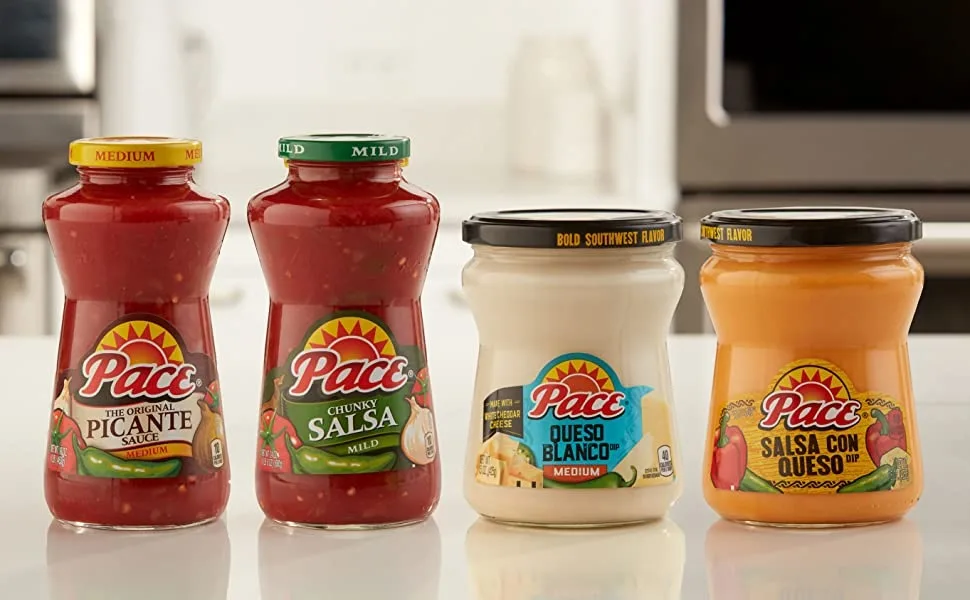 Pace Salsa Con Queso Cheese Dip, Great for Nachos, 15 Ounce Jar (Pack of 6) - Two jars of Pace salsa and two jars of Pace queso in a row on a counter top