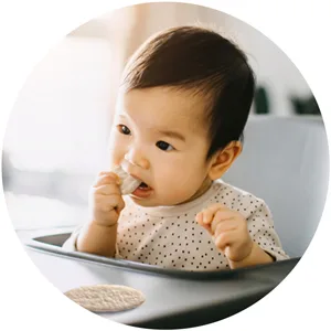 Gerber Snacks for Baby Teethers, Organic Gentle Teething Wafers, Mango Banana Carrot, 1.7 Ounce (Pack of 6) - Baby chewing on Organic Teethers