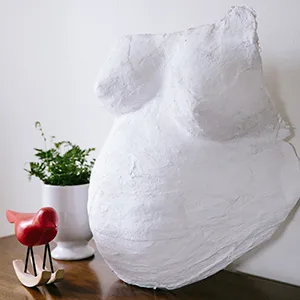 Pearhead Belly Casting Kit, Gender-Neutral Pregnancy Keepsake for Expecting Mothers, Baby Nursery Dcor, Mothers Day Keepsake, White - Complete belly cast displayed on tabletop in baby nursery