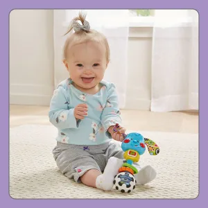 VTech Baby Rattle and Sing Puppy Standard Packaging - Child touching crinkly ears