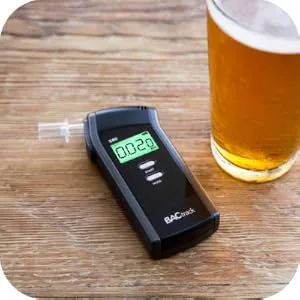 BACtrack S80 Breathalyzer | Professional-Grade Accuracy | DOT & NHTSA Approved | FDA 510(k) Cleared | Portable Breath Alcohol Tester for Personal & Professional Use - BACtrack S80 on Table