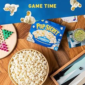 Pop Secret Jumbo Popcorn Kernels, 30 Ounce Jar - POP SECRET popcorn bowl served on a table with board games