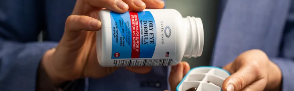 Dry Eye Formula Advanced Ocular Vitamin (90 ct.) - Woman holding EyeScience Dry Eye Formula vitamin bottle filling vitamin case