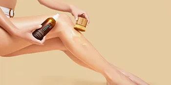 COOLA Sunless Self Tanner Kabuki Body Brush, Self Tan Applicator for Organic Sunless Tanning Lotion - model using coola kabuki body brush to apply sunless tan to legs