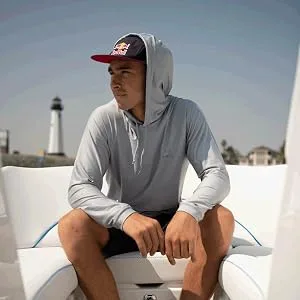O'Neill Wetsuits Men's O'Neill Basic Skins UPF 50+ Long Sleeve Sun Shirt Medium Pacific - man sitting on a boat wearing o