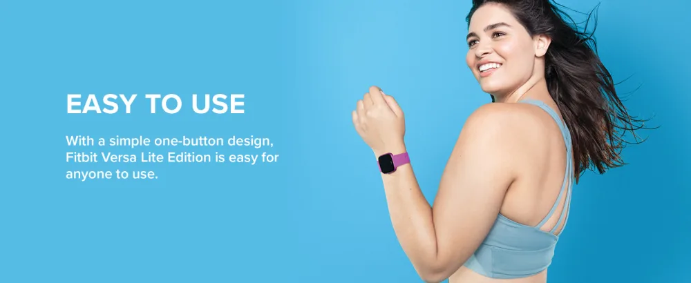 Fitbit Versa Lite White/Silver Aluminum - Woman in a light blue workout top smiling