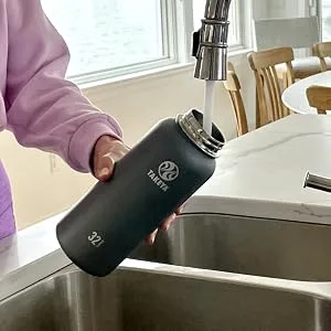 Takeya Bottle Replacement Spout Lid, Ocean, Blueberry Originals Ocean Blueberry - pouring water into bottle