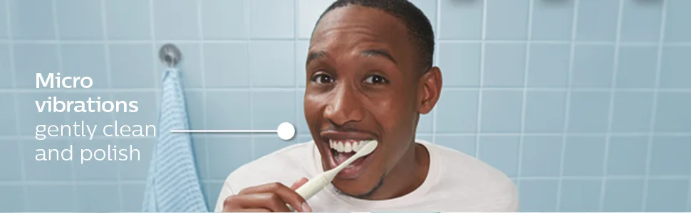 Philips One by Sonicare, 2 Brush Heads, Snow, BH1022/07 - Micro vibrations gently clean and polish. Man brushing teeth