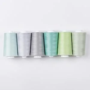 Superior Threads Omni 40-Weight Polyester Sewing Quilting Thread Cone 6000 Yard (Natural White) - Omni thread cones in a line
