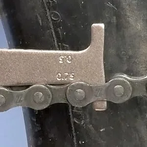 Park Tool CC-3.2 Chain Wear Indicator Tool 1 Silver - Bicycle chain with 0.75 percent wear as measured by Park Tool CC-3.2 Chain Checker
