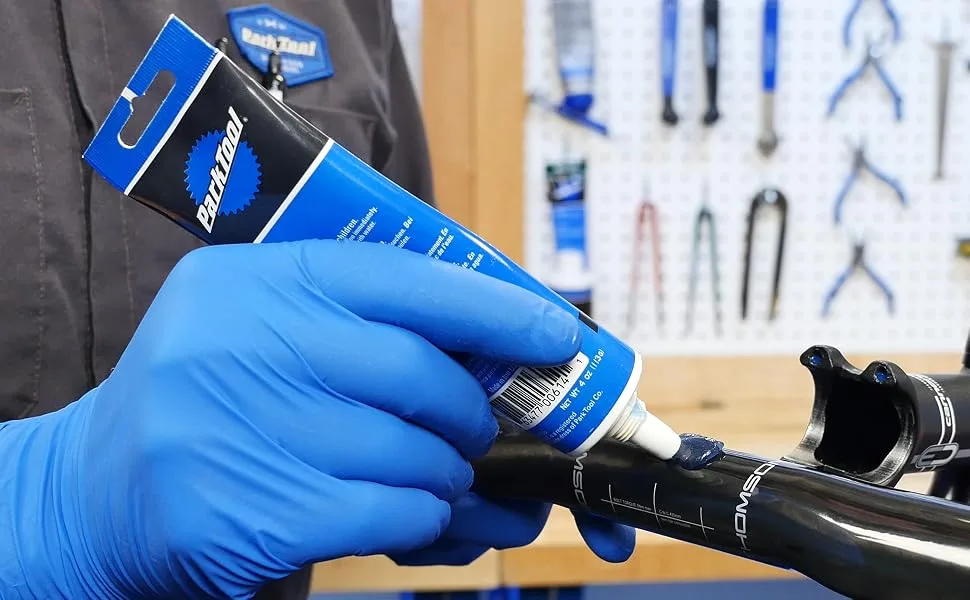 Park Tool Supergrip Carbon and Alloy Assembly Compound - 4 oz. tube Compound 4-Ounce - SAC-2 being applied to a bicycle handlebar before assembly