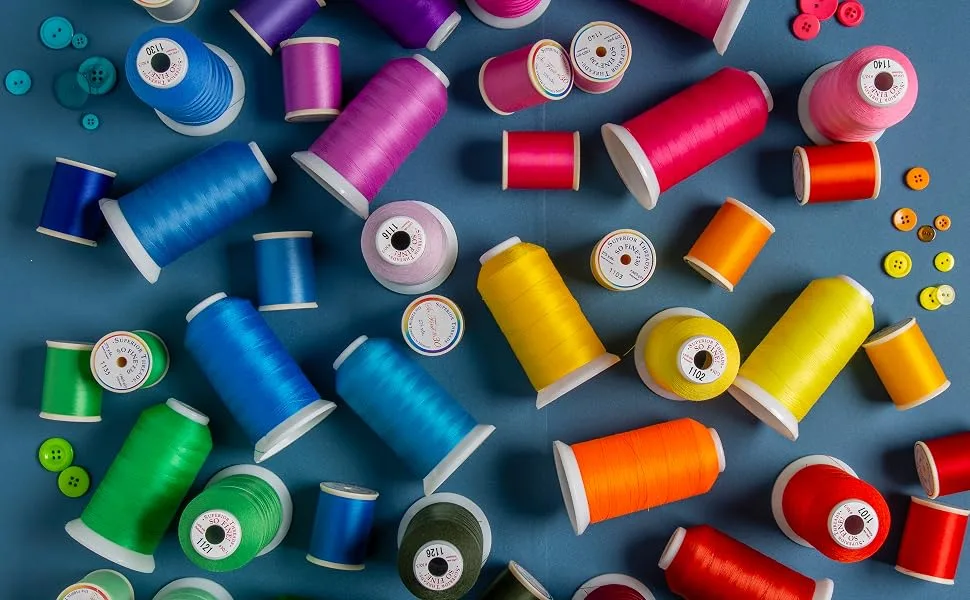 Superior Threads - Smooth Polyester Sewing Thread for Serger, Bobbin Thread, and Quilting, So Fine #401 Snow, 3,280 Yd. Cone 3280 yd Snow - A colorful assortment of So fine thread spools and cones