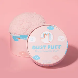 Megababe Body Powder Applicator - Dust Puff | Oversize (6 x 3) Powder Puff | Powder Sold Separately - Pink background. Dust Puff is visible in bottom half of cardboard case. Lid is propped up next to it