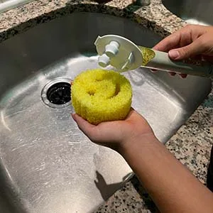 The Original Smiling Sponge Handle Soap Dispensing Handle for Scrub Daddy Sponge (White) Second Generation - Dish Daddy soap dispensing handle for the Scrub Daddy Sponge Installing 2