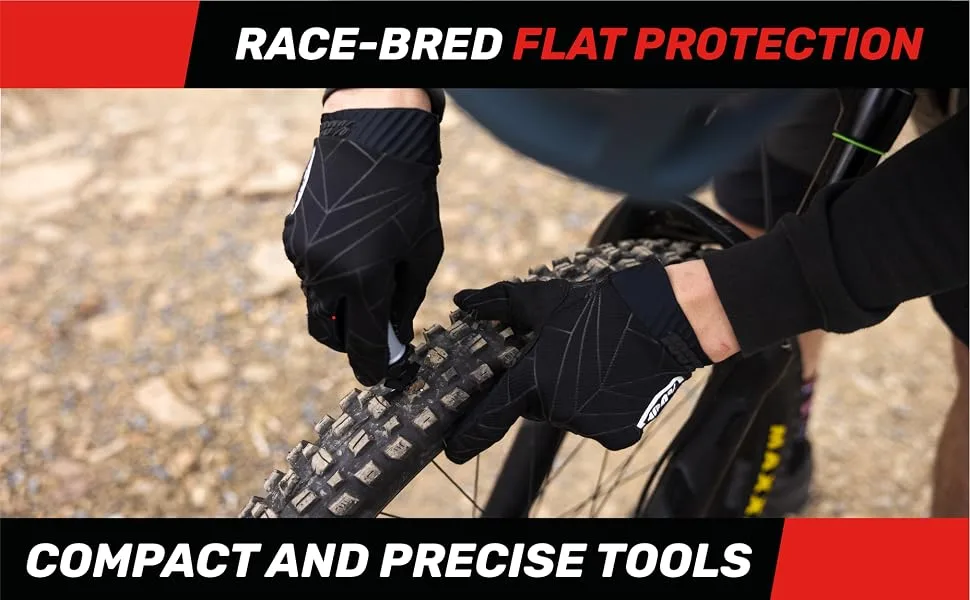 Stan's NoTubes Valve STEM Pair, Universal, Brass, Presta, 55MM - A person holding several Stan