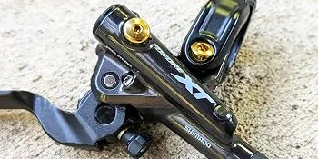 Titanium Brake Hardware Kit | Shimano XTR/XT/SLX/Deore (Natural Ti) - Terske Gold titanium bolt kit on Shimano XT Disc Brake Lever