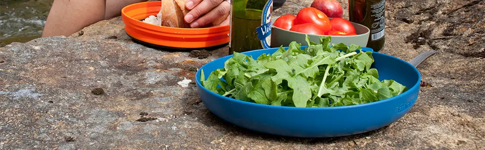 Sea to Summit Alpha Light Utensil, Spork - Delta Plate holding a salad.