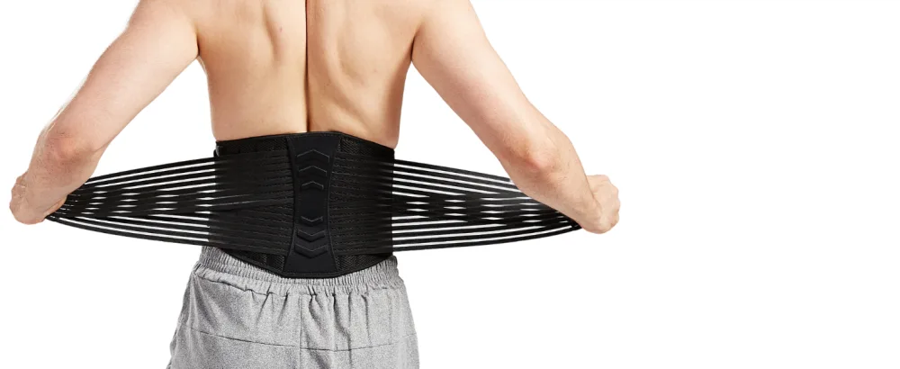 Lumbar Support Back Brace for Men and Women (Regular 28" - 50") - Man adjusting the outer layer of the back brace