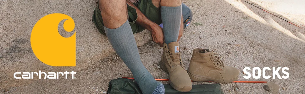 Carhartt mens Men's Force Performance Work Socks 3 Pair Pack Large Black - man putting on socks