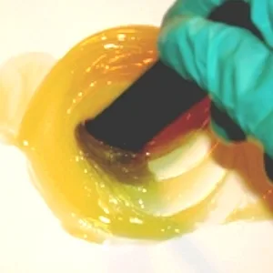 West System G/Flex Epoxy (2-4oz) UNITS - WEST SYSTEM G/flex 655 Thickened Epoxy Adhesive being stirred.