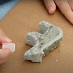STUDIOSTONE CREATIVE Bear Soapstone Sculpture Stone Carving DIY Arts Crafts Kit Kids Adults - Close up of soapstone bear being carved and waxed