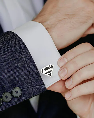3D Luke Skywalker Helmet Cufflinks - Man showing his super silver and black superman shield cufflinks