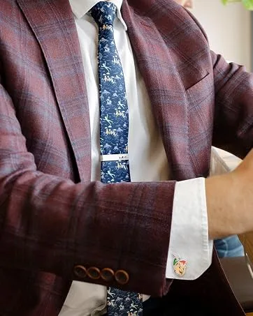 3D Luke Skywalker Helmet Cufflinks - Man wearing a maroon plaid suit and Peter Pan themed cufflinks and tie