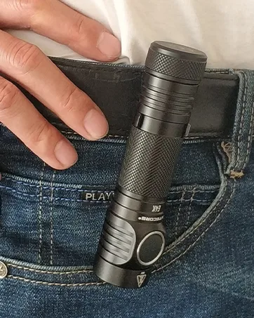 Nitecore Tip SE Black Keychain Flashlight, 700 Lumen USB-C Rechargeable EDC with LumenTac Keychain Light - flashlight clipped to a belt on a pair of jeans