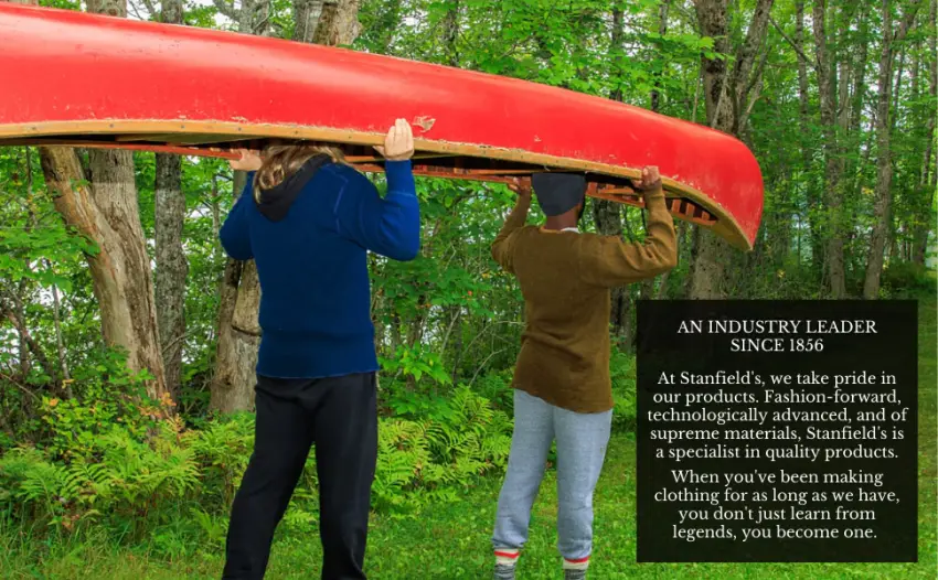 Stanfield's Cotton Rib Combination Top, Grey Heather, Small - Two men carrying a canoe wearing a hoodie, henley, pants, hat, long johns