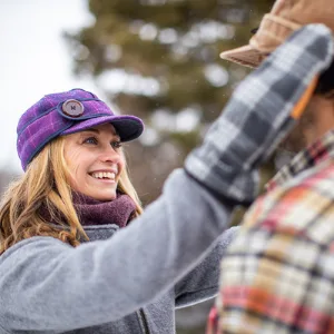 Stormy Kromer Original Kromer Cap - Winter Wool Hat with Earflap 7 3/4 Blaze Orange - woman adjusting man
